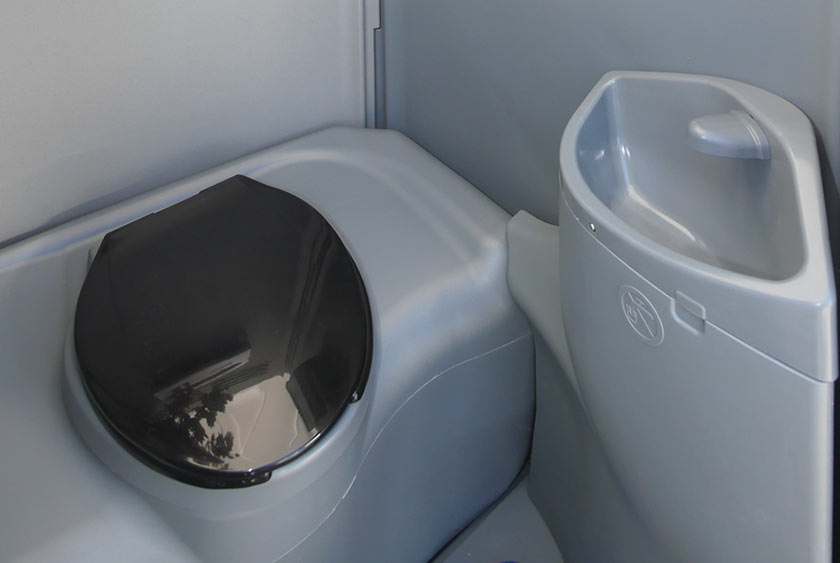 FRESH WATER FAUCET AND SINK NEXT TO TOILET