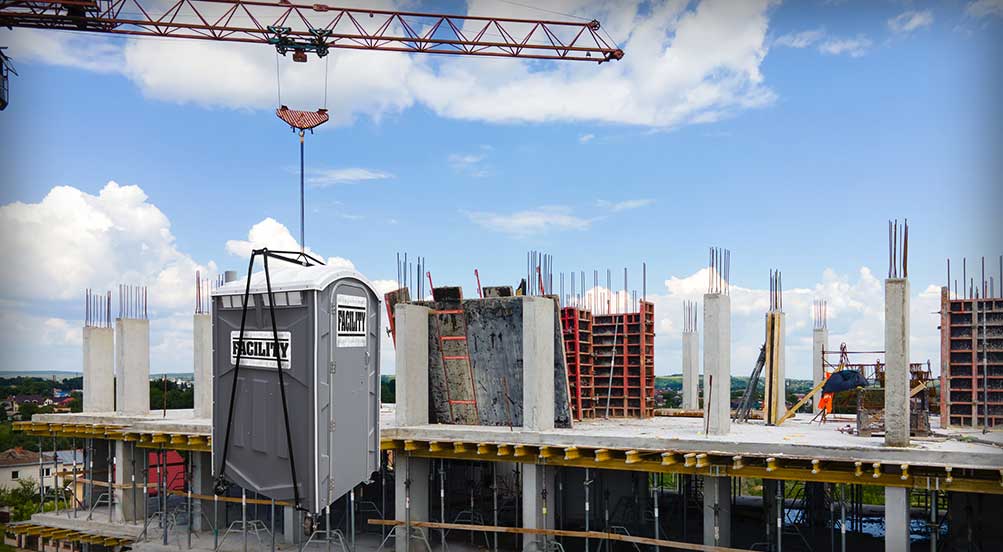 The FACILITY Portable Toilet Being Hoisted by Crane in New York