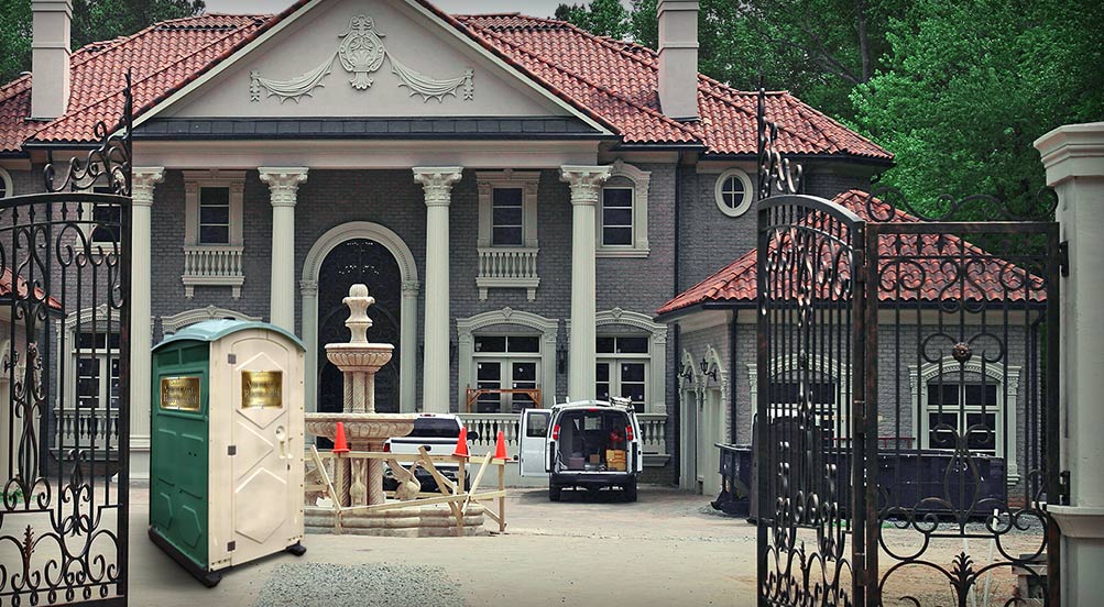 The VINTAGE Portable Restroom Being Used for New Construction of a Large Residence