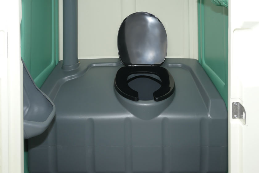 THE VINTAGE PORTABLE RESTROOM HAS A LARGE, COMFORTABLE TOILET SEAT