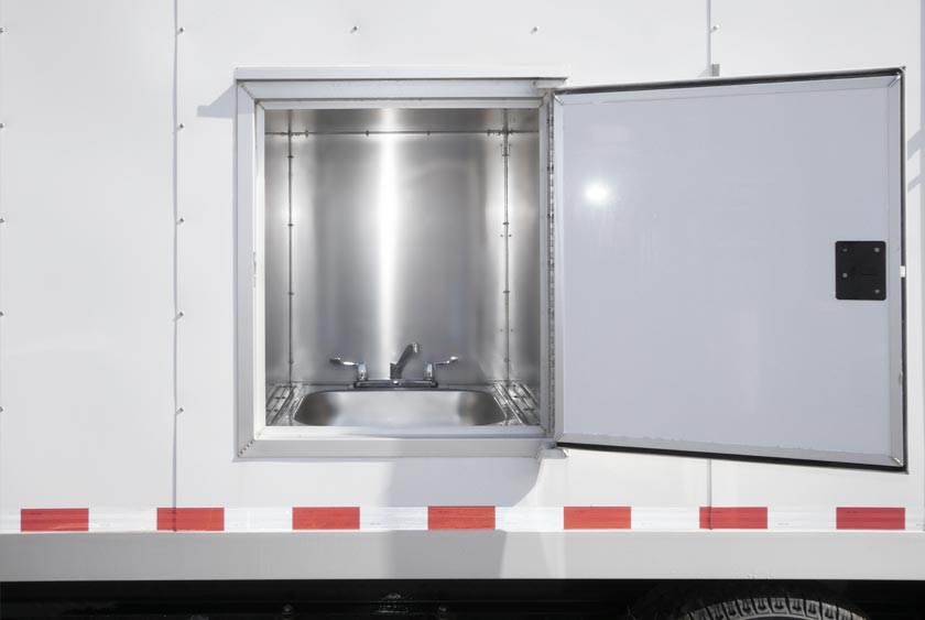 UTILITY SINK SYSTEM ON OUTSIDE OF THE TRAILER