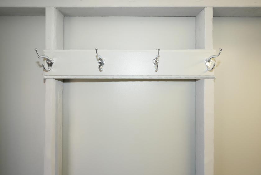 FOUR COAT AND HAT HOOKS ON THE INTERIOR