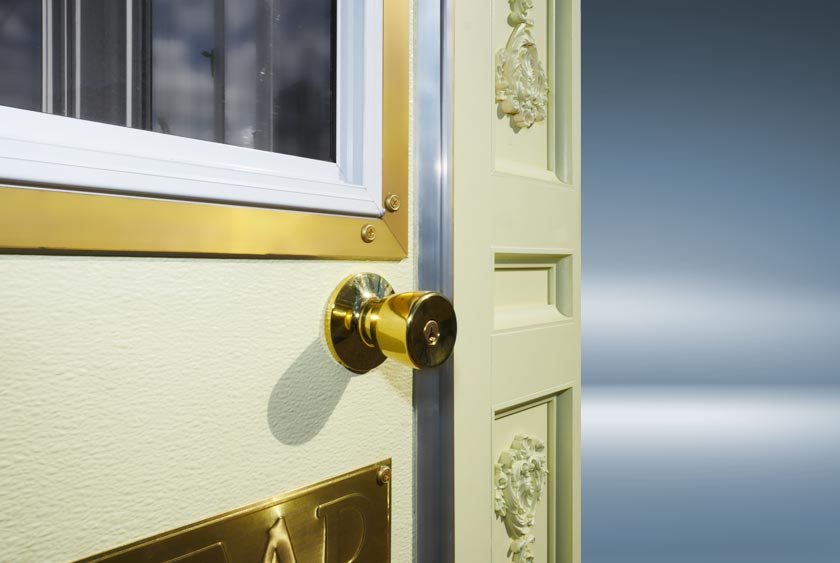 CALLAHEAD DESIGNER PLATES, DOORKNOBS, AND TRIM EXTEND AROUND THE WINDOWS AND DOORS