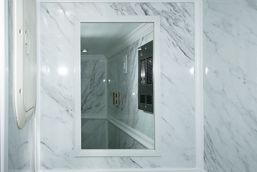 FRAMED MIRROR ABOVE SINK AREA