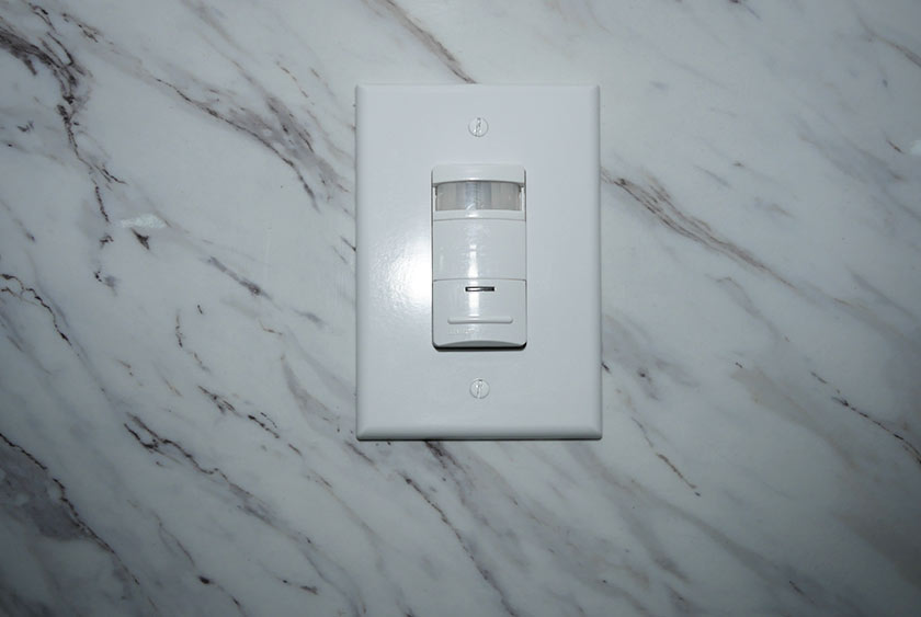 MOTION SENSOR INSIDE RESTROOM CONSERVES ELECTRICITY