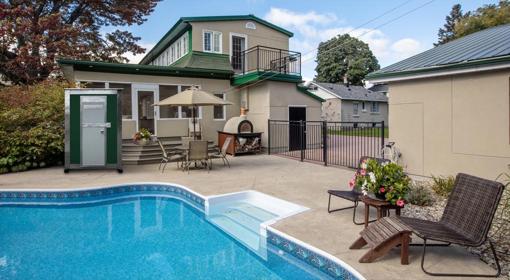 A25 STORAGE SHED IN A BACKYARD BY THE POOL