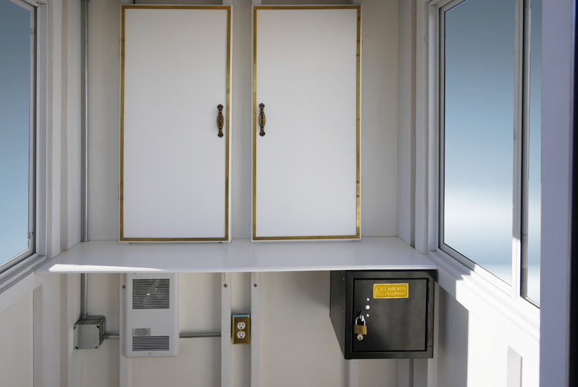 TWO INTERIOR CABINETS WITH BRASS TRIM