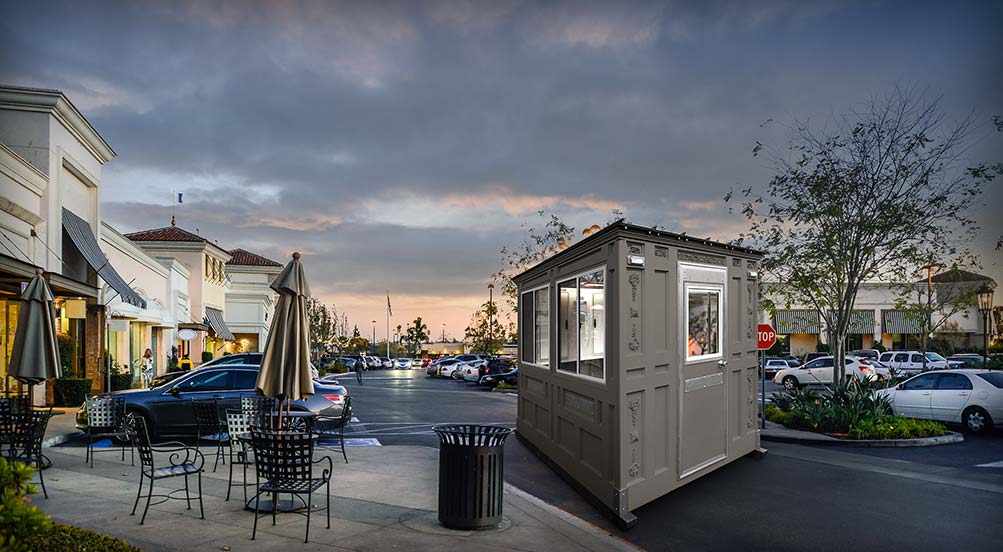A Grey Valet Key Booth 48 in Front of a Shopping Mall Parking Lot