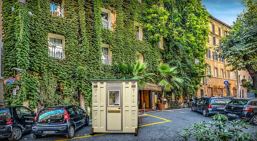 A Blue Valet Key Booth 48 in Front of a Residential Area