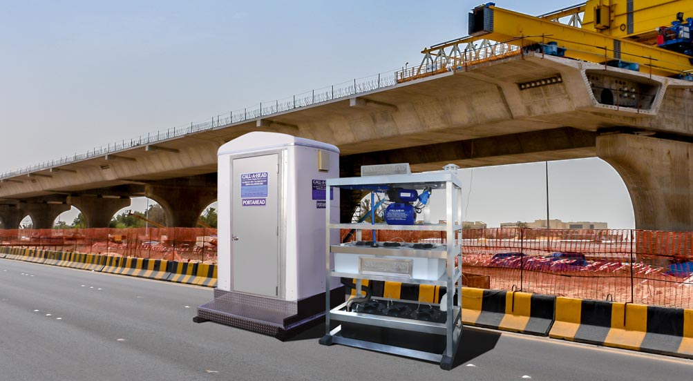 Water & Sewer Tower | Water & Sewer Tower Outdoors at a Bridge Construction Site with a Crane