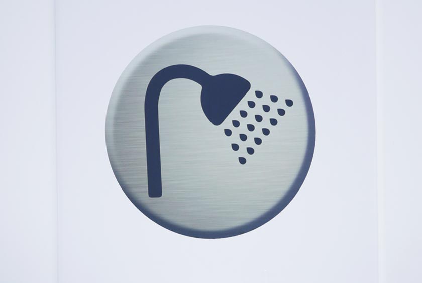 SHOWER SIGN ON ENTRANCE DOOR
