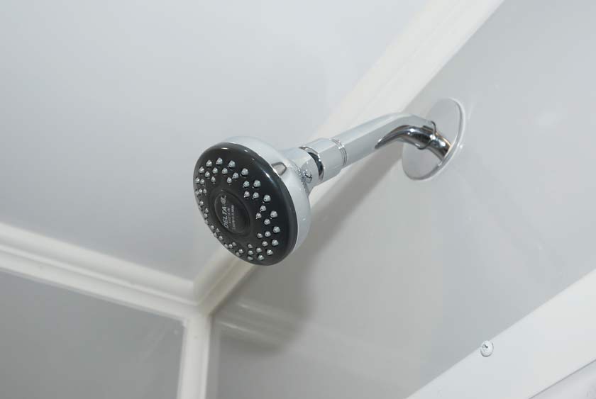 OVERSIZED SHOWER HEADS IN EACH OF THE EIGHT PRIVATE SHOWER STALLS