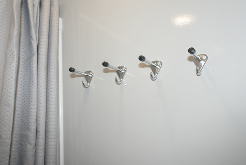 FOUR CONVENIENT HOOKS INSIDE EACH SHOWER AREA