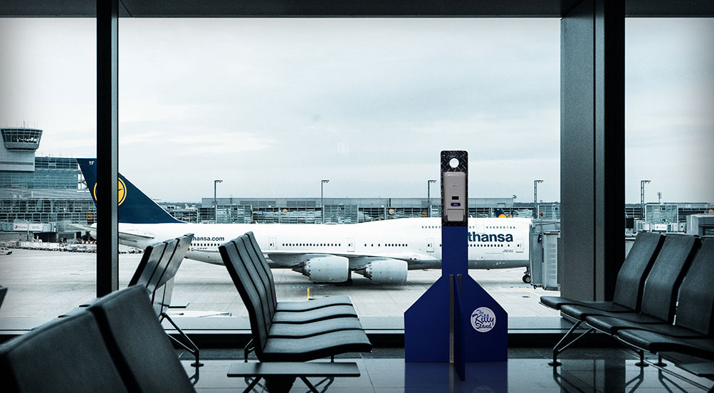 killy stand inside a airport waiting area