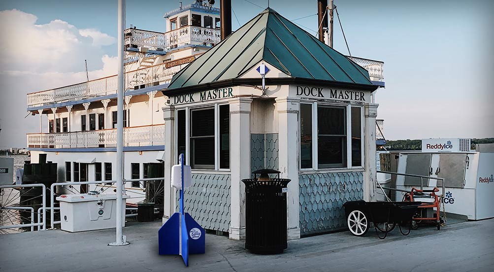 killy stand next to a security booth