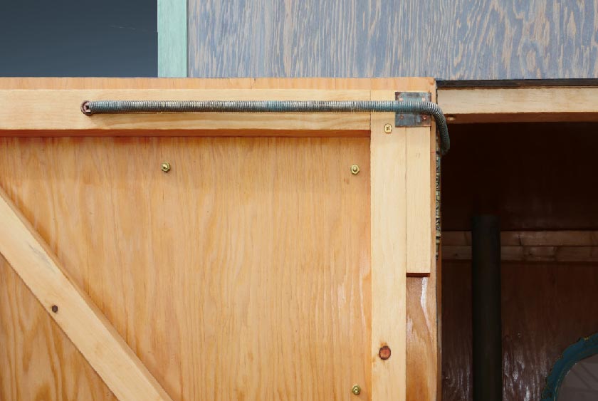 SELF CLOSING WOOD DOOR FOR PRIVACY.