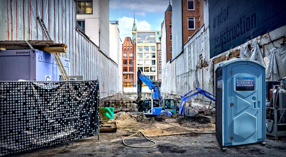 The Hammerhead Portable Toilet Near City Construction Site