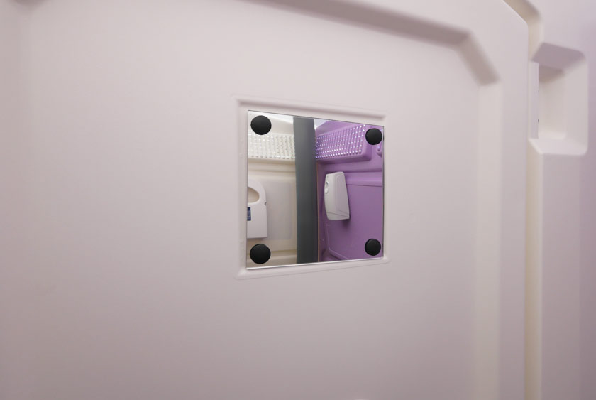 MIRROR LOCATED ON THE BACK OF THE DOOR