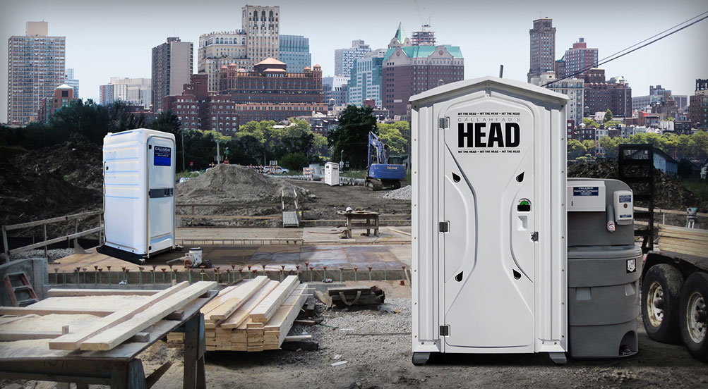 THE HEAD PORTABLE TOILET, THE WASHBASIN AND THE SHOWERHEAD Near Building Site