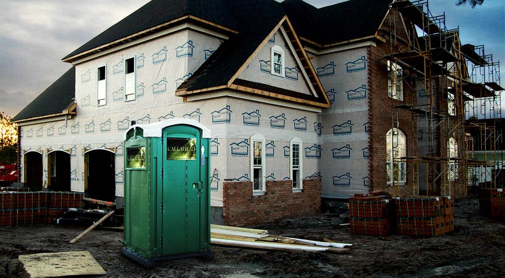 THE GREEN HEAD PORTABLE TOILET Near Residential Construction