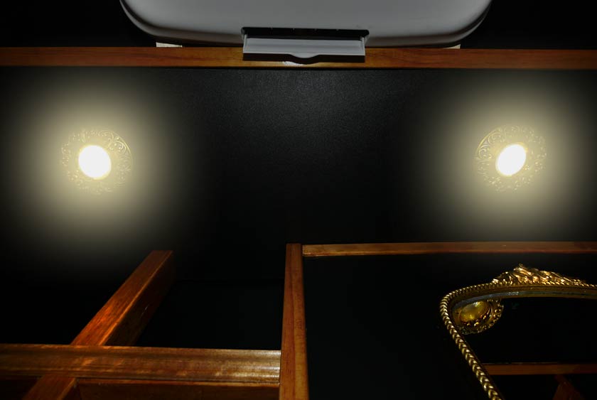 TWO 5” BRASS-TRIMMED HIGH-HAT LED LIGHT FIXTURES OVERHEAD