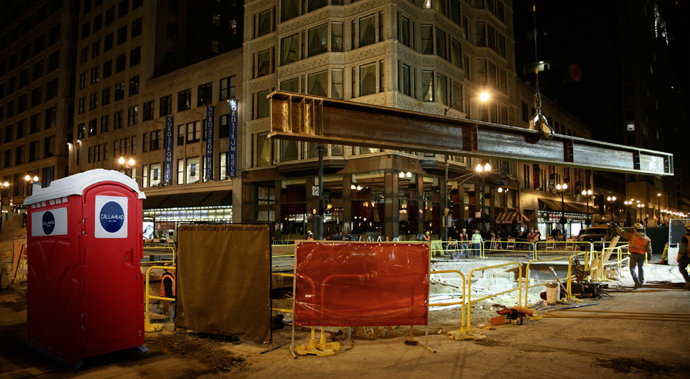 The Red Head Portable Toilet Near City Construction