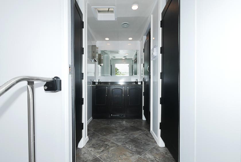 ENTRANCE INTO THE AQUEDUCT RESTROOM TRAILER