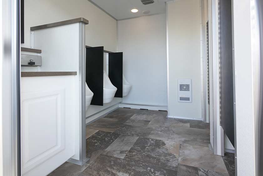 THE BAYSIDE RESTROOM TRAILER MEN'S ENTRANCE