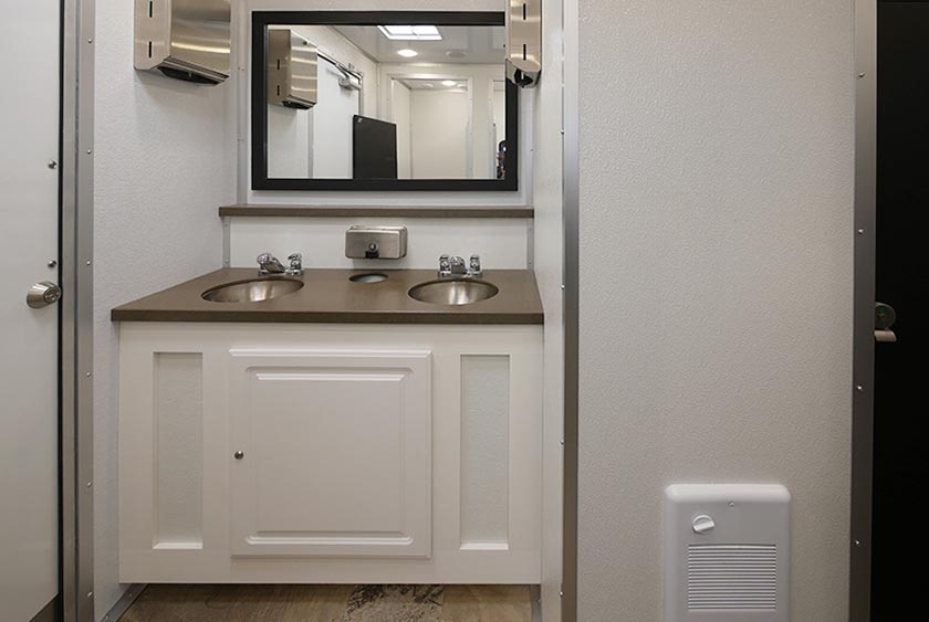 LARGE MIRROR OVER VANITY, PLUS STORAGE AREA BENEATH THE VANITY