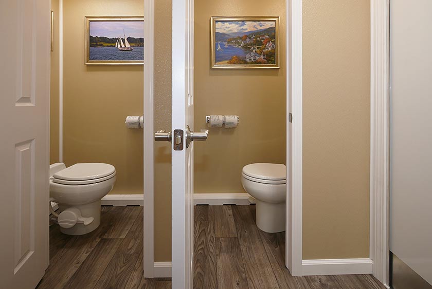 BRUSHED NICKEL DOOR HANDLE AND LOCKING SYSTEM IN EACH PRIVATE BATHROOM STALL