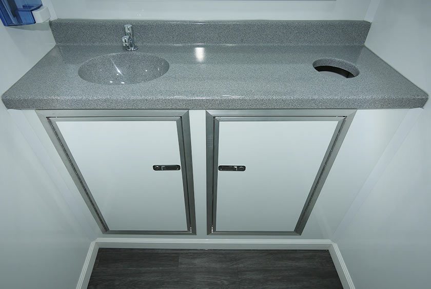 CORIAN COUNTERTOP IN ONE OF THE RESTROOMS