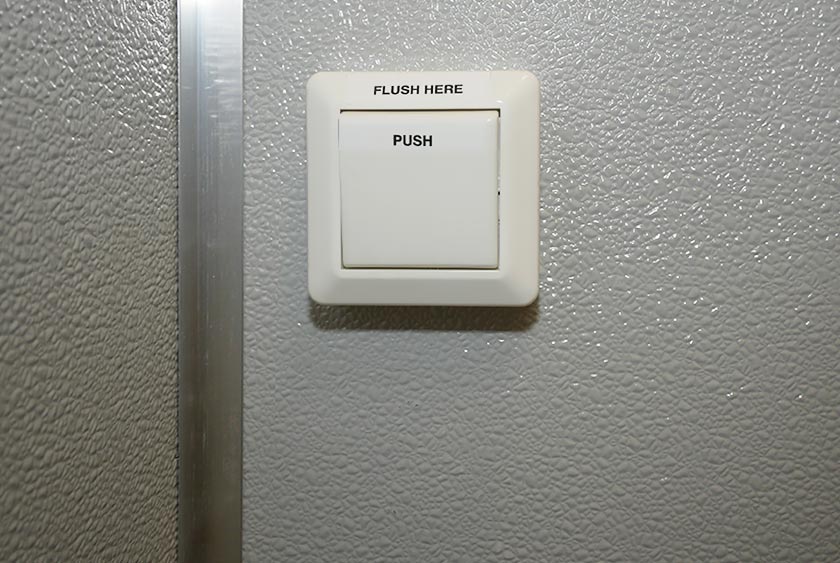 PUSH BUTTON FLUSHING TOILET
