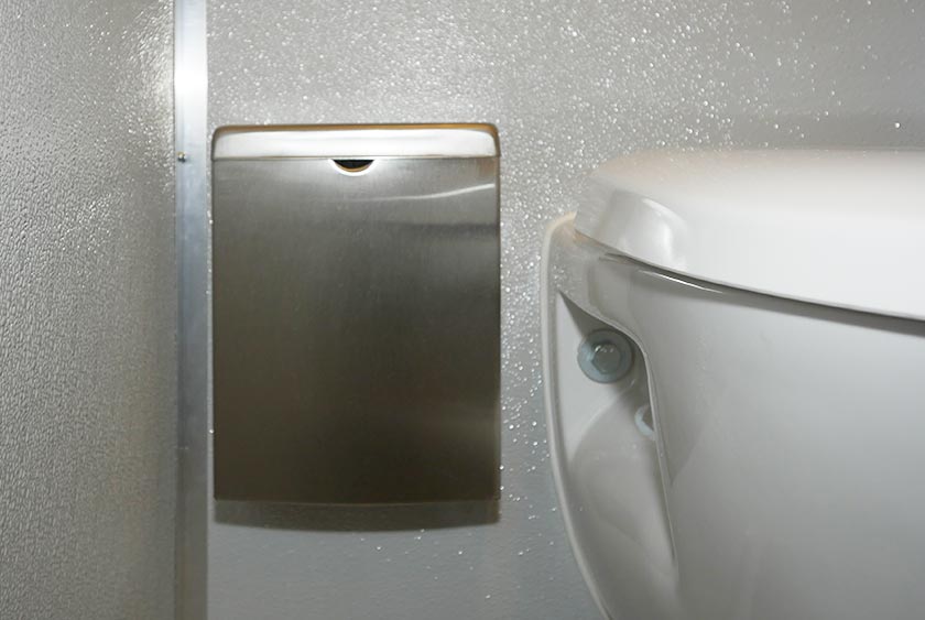 TRASH RECEPTACLE NEXT TO TOILET