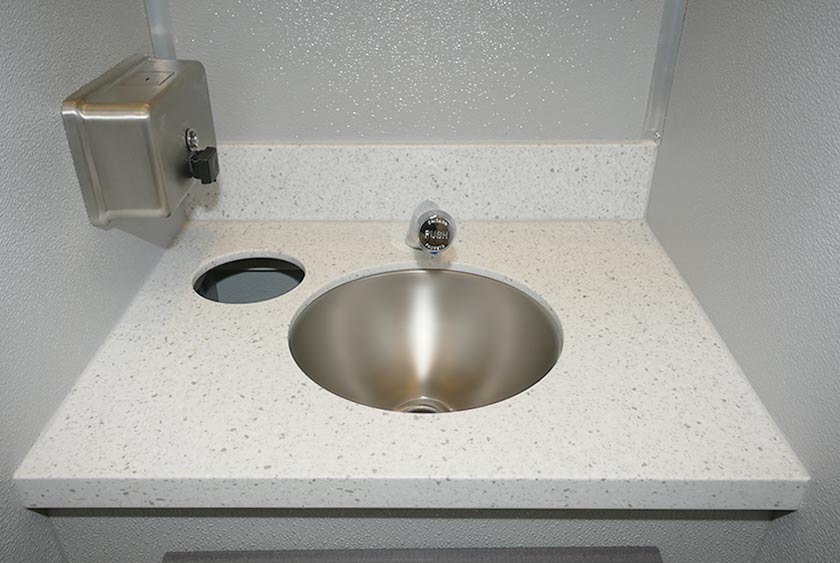 CORIAN COUNTERTOPS WITH SOAP DISPENSER AND TRASH RECEPTACLE