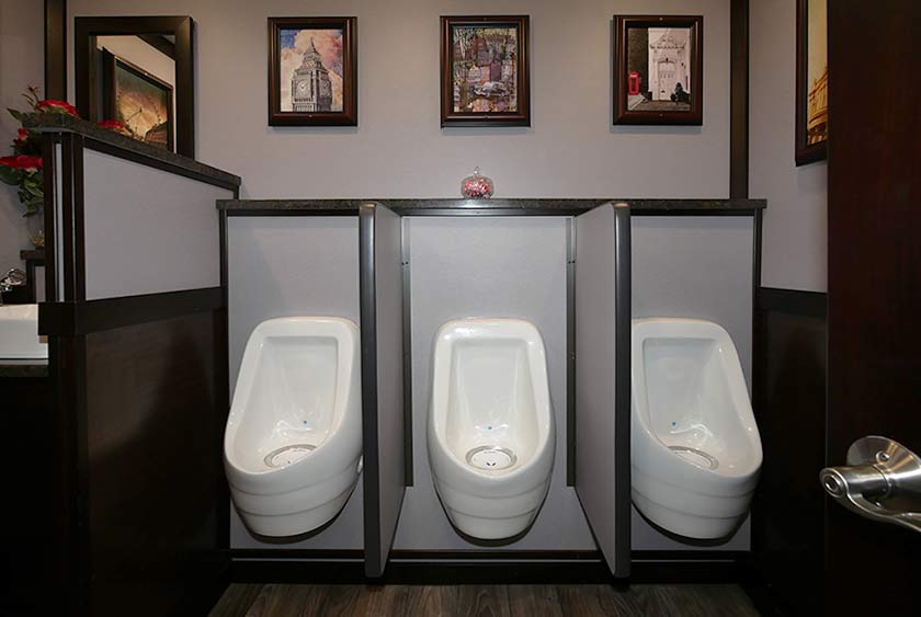 THREE ODORLESS, PORCELAIN URINALS ON THE MEN'S SIDE