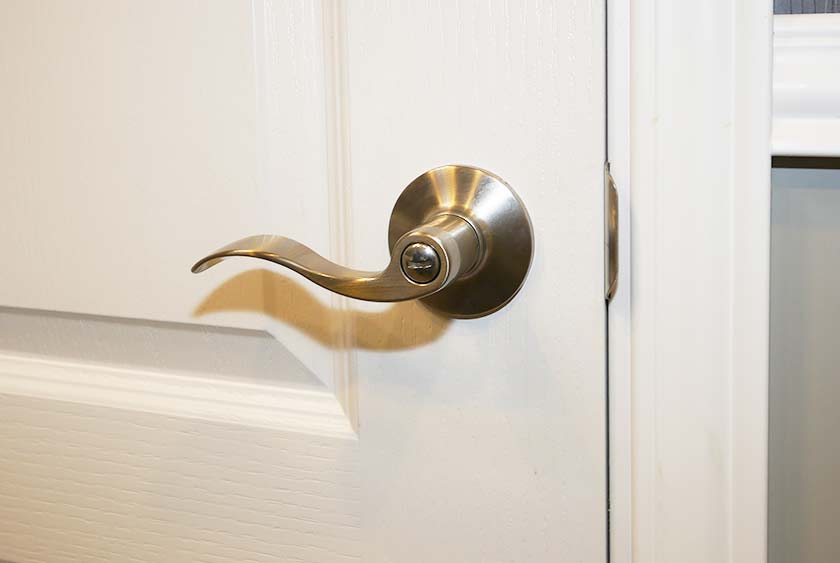 BRUSHED NICKEL DOOR HANDLE AND LOCKING SYSTEM IN EACH PRIVATE BATHROOM STALL