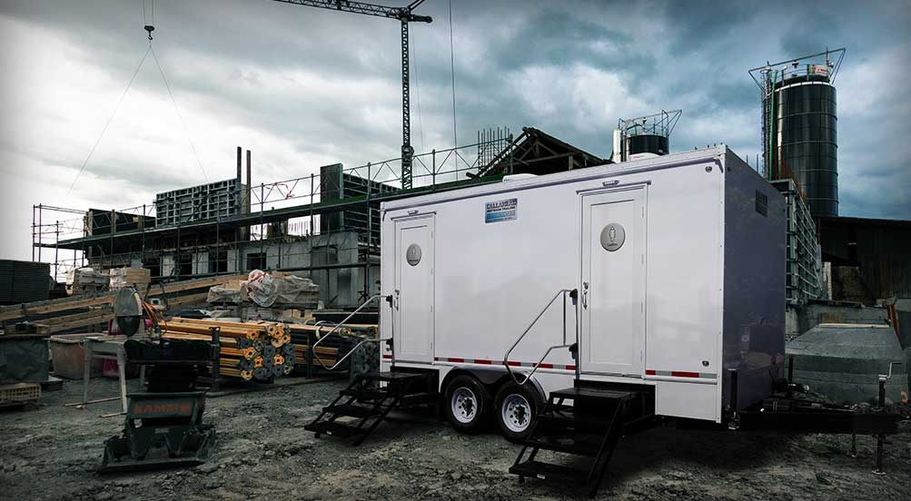 The Rover Restroom Trailer Rental Near A Building Site