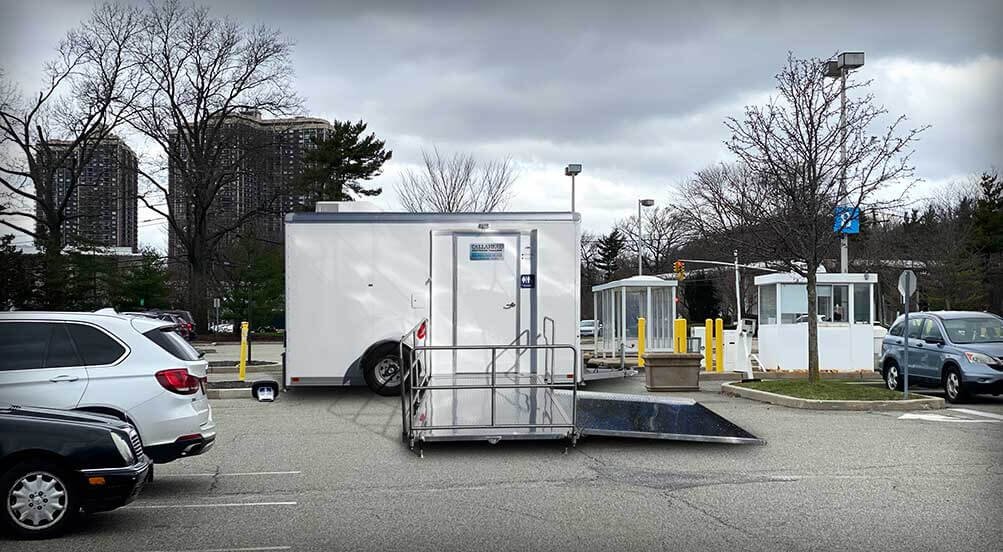 The Sovereign ADA Restroom Trailer Near Parking Lot