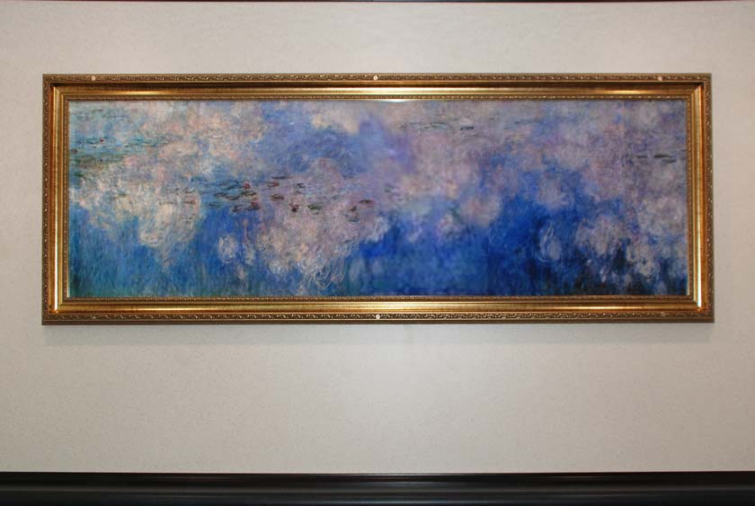 GOLD FRAMED ARTWORK INSIDE THE BILTMORE RESTROOM TRAILER