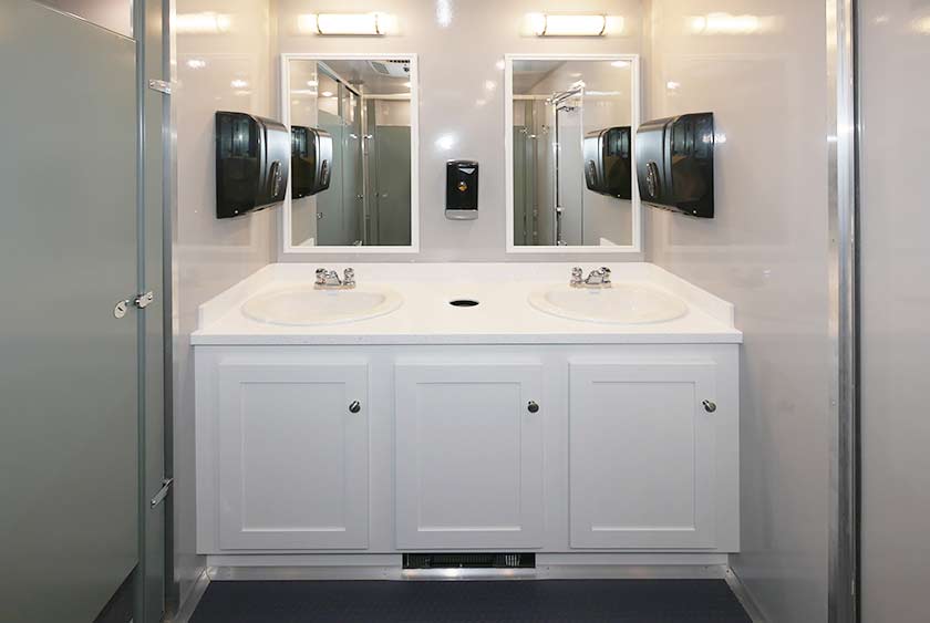 WOMEN'S VANITY AREA INCLUDES 2 SINKS AND 2 MIRRORS WITH VANITY LIGHTING
