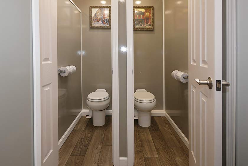 PRIVATE TOILET STALLS WITH FLOOR TO CEILING LOCKABLE DOORS