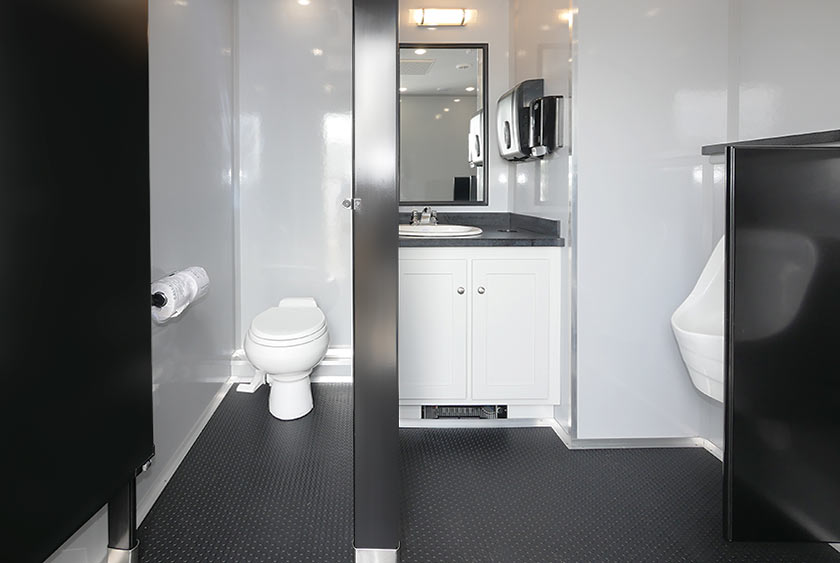 MEN'S SIDE VANITY, ONE PRIVATE STALL AND THREE URINALS WITH PRIVACY DIVIDER