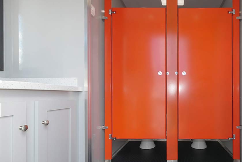 WOMEN'S ENTRANCE TO THE CONSTRUCTION RESTROOM TRAILER