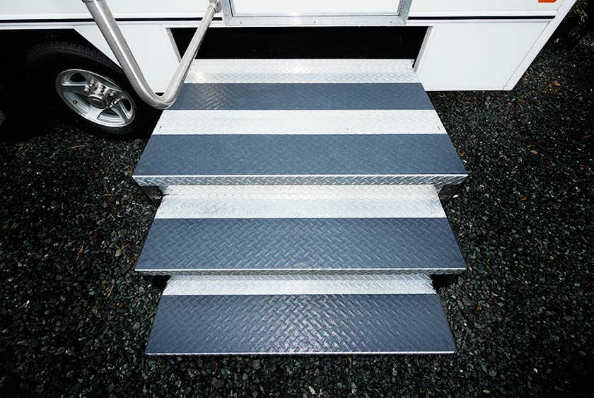 WIDE, FLOATING STEEL STAIRCASES WITH ALUMINUM HANDRAILS