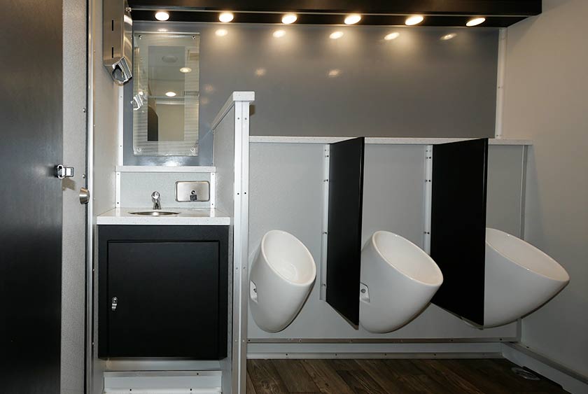 MEN'S SIDE INCLUDES VANITY WITH SINGLE SINK AND LARGE MIRROR