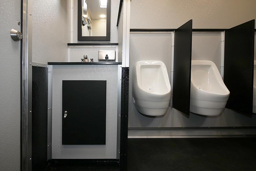 MEN'S SIDE VANITY AREA WITH PRIVACY DIVIDER FOR URINALS