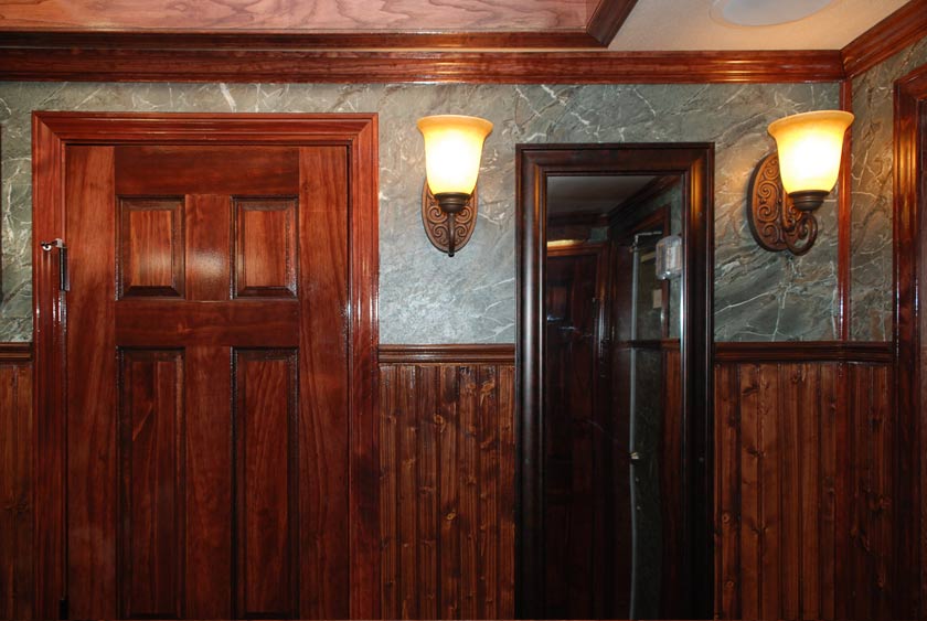 RICH WOODWORK WITH ELEGANT LIGHTING