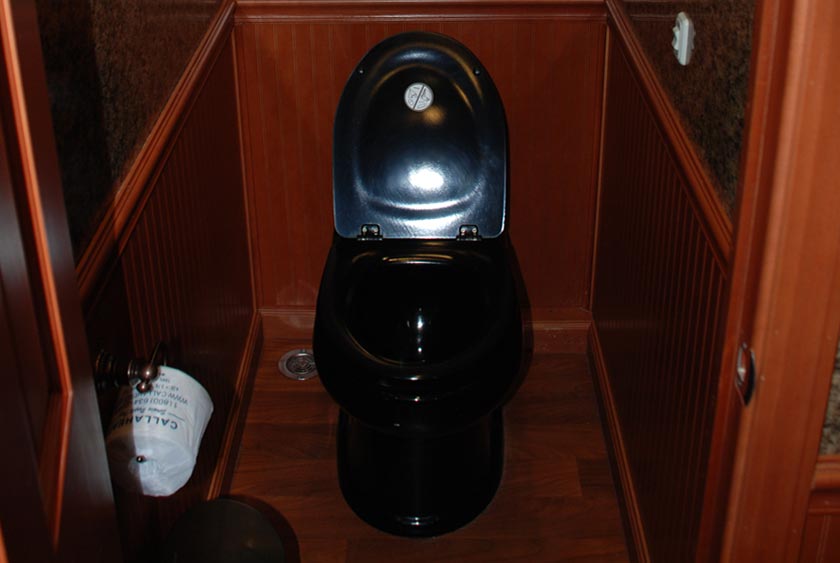 PRIVATE BATHROOM STALLS WITH PEDAL FLUSH PORCELAIN TOILETS