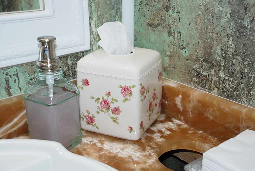 VANITY AREA CONTAINS FLORAL ARRANGEMENT, DESIGNER SOAP DISPENSER, HAND TOWELS, TISSUE HOLDER, CANDY DISH 