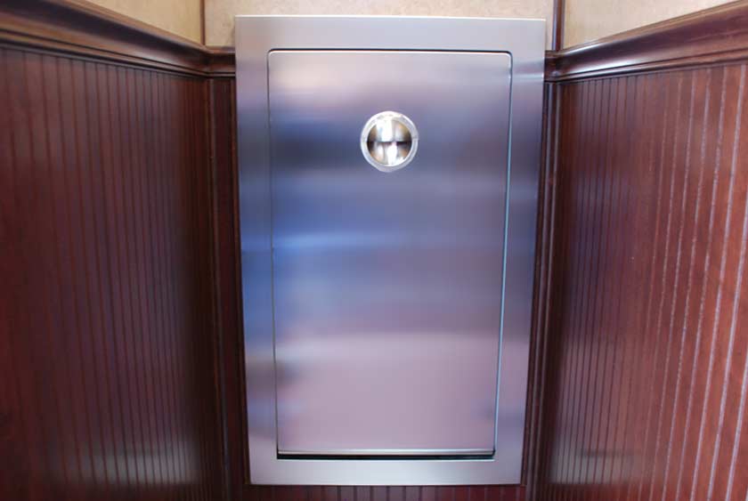 FOLD-DOWN BABY CHANGING STATION IN ONE OF WOMEN'S STALLS